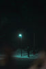 man standing underneath light