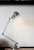 silver desk lamp on white table