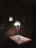 white and black table lamp on brown wooden table