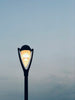 black street light under gray sky