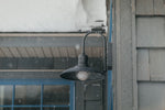 a street light on a snowy day outside a building
