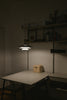 a table with a lamp on top of it
