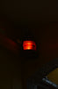 a red light on a ceiling