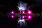 A couple of lights that are on some water