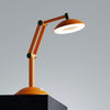 A desk lamp sitting on top of a black block