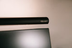 A yeelight monitor light is shown above a screen.