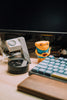 Desk setup with accessories and a keyboard.