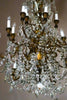 A luxurious, crystal chandelier shines beautifully.