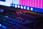 A miniature genie lamp sits on a keyboard.