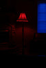 A red lamp illuminates a dark room