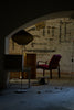 Vintage armchair and lamp in dimly lit room