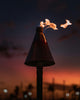 a lamp post with some fire coming out of it