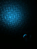 a black background with a blue dot pattern