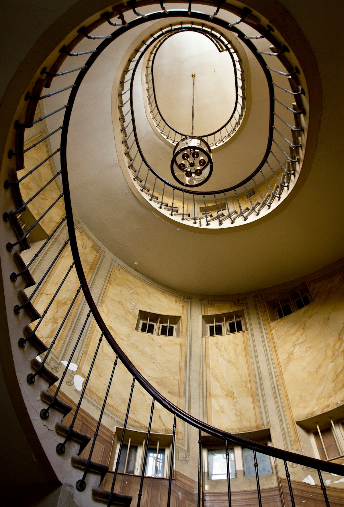 spiral stairs with chandelier