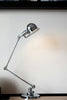silver desk lamp on white table