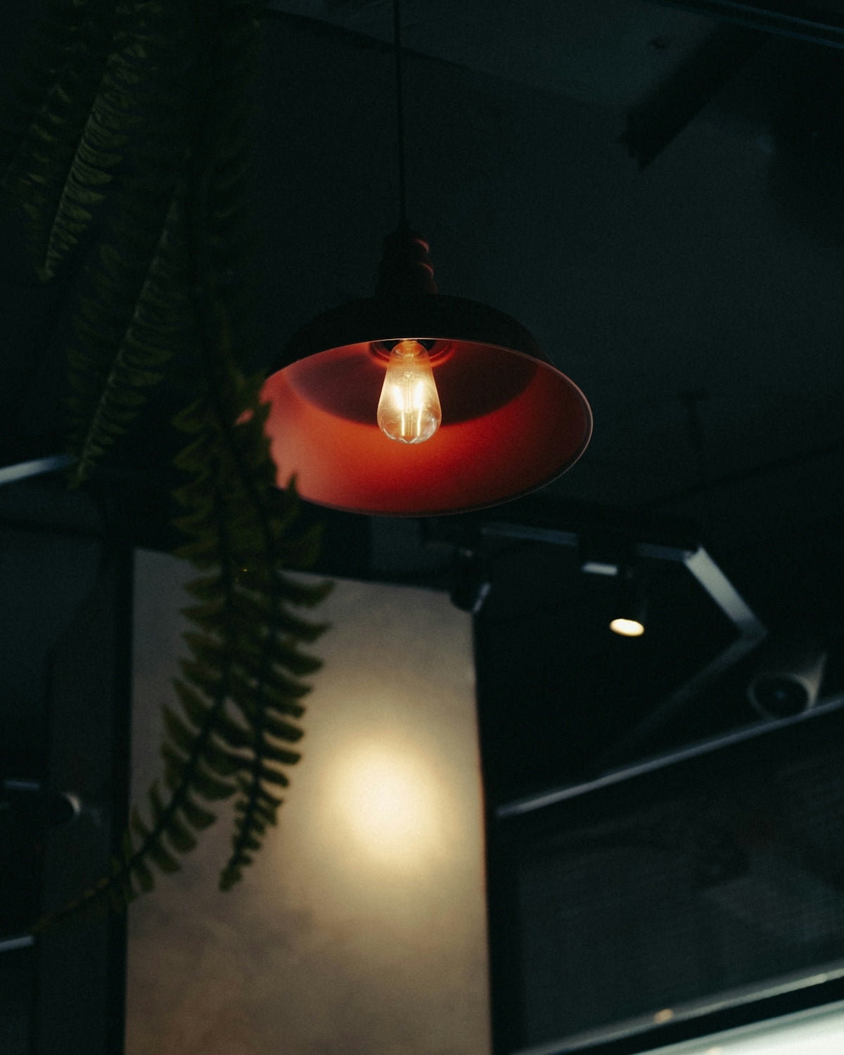 orange pendant lamp turned on during nighttime