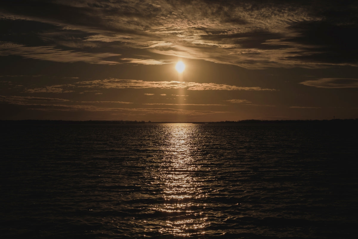 body of water during sunset