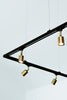 black metal frame with brass light bulb