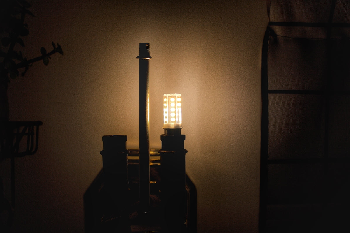 black metal candle holder with candle