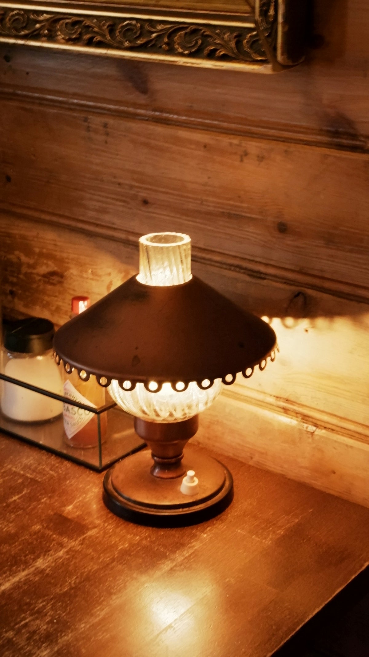 a lamp sitting on top of a wooden table