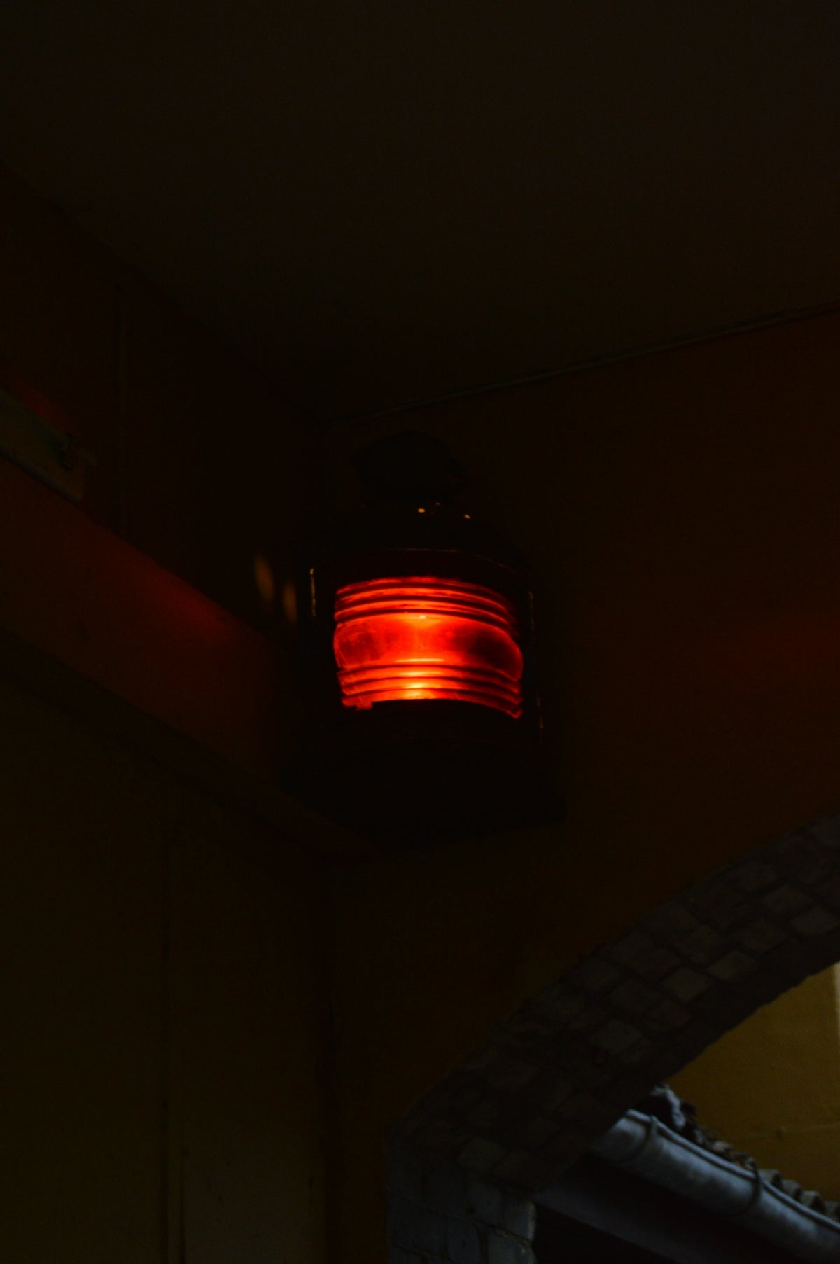 a red light on a ceiling