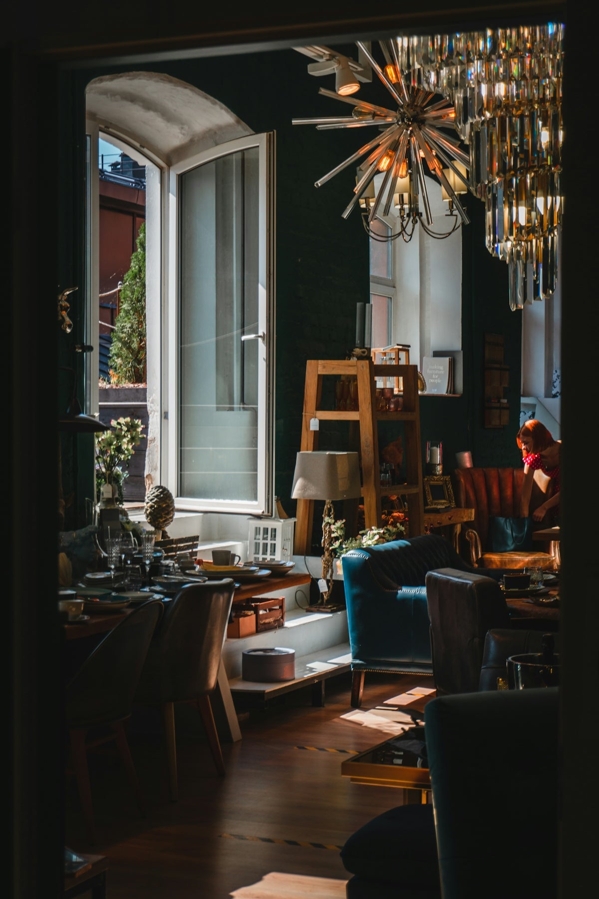 a living room with a chandelier and a couch