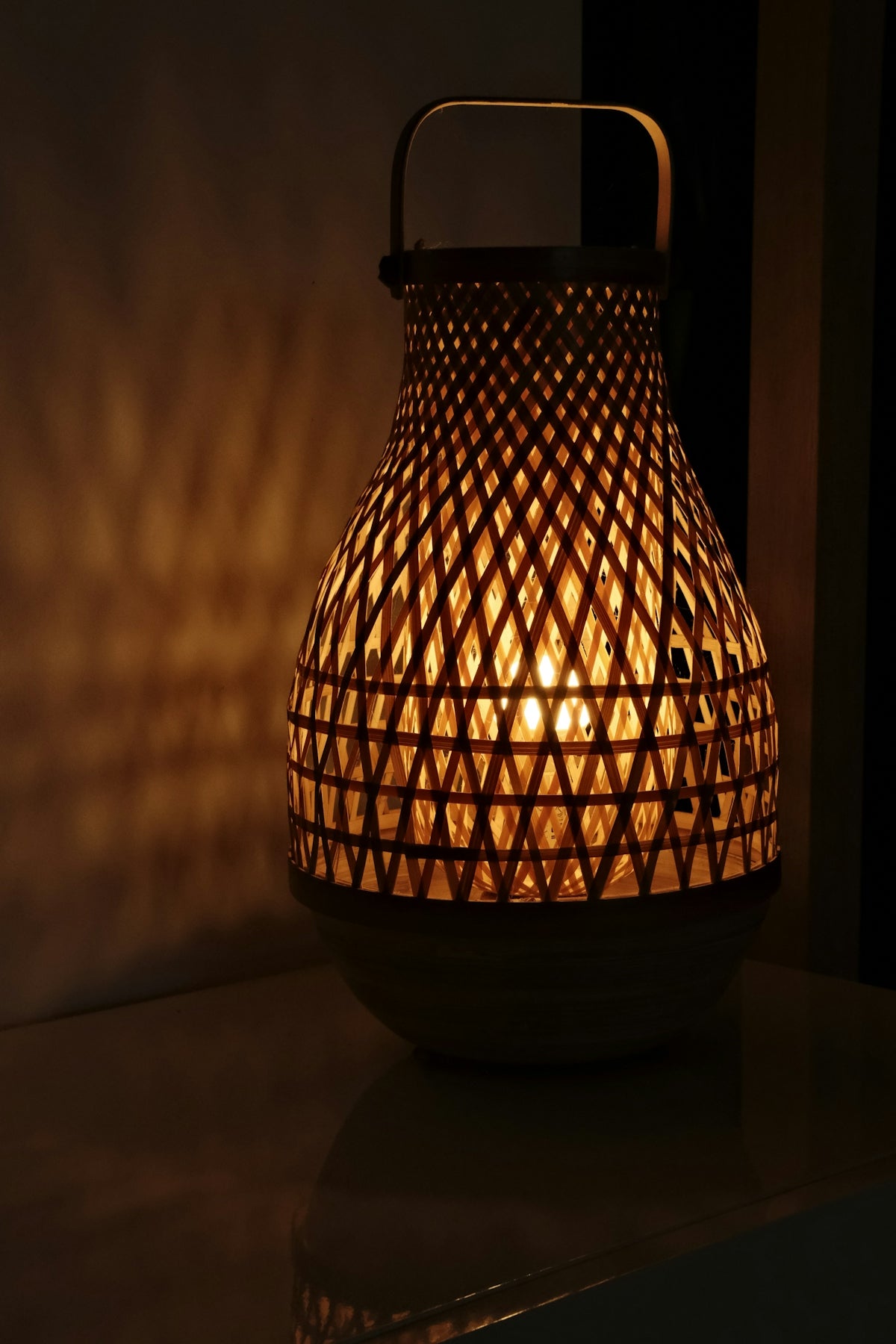 a lit candle sitting on top of a table