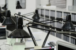 a desk with a bunch of lights hanging from it
