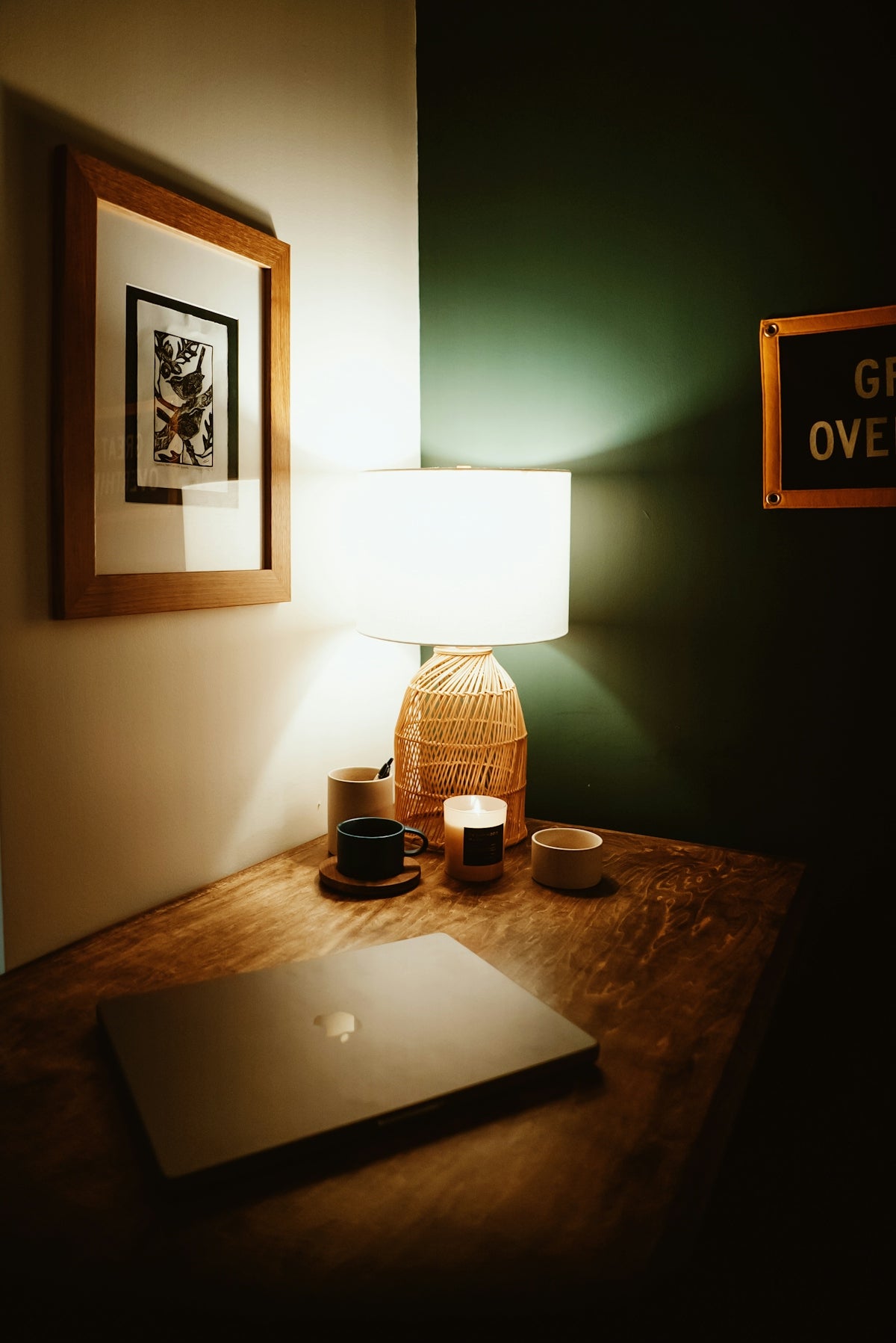 a laptop computer sitting on top of a wooden desk