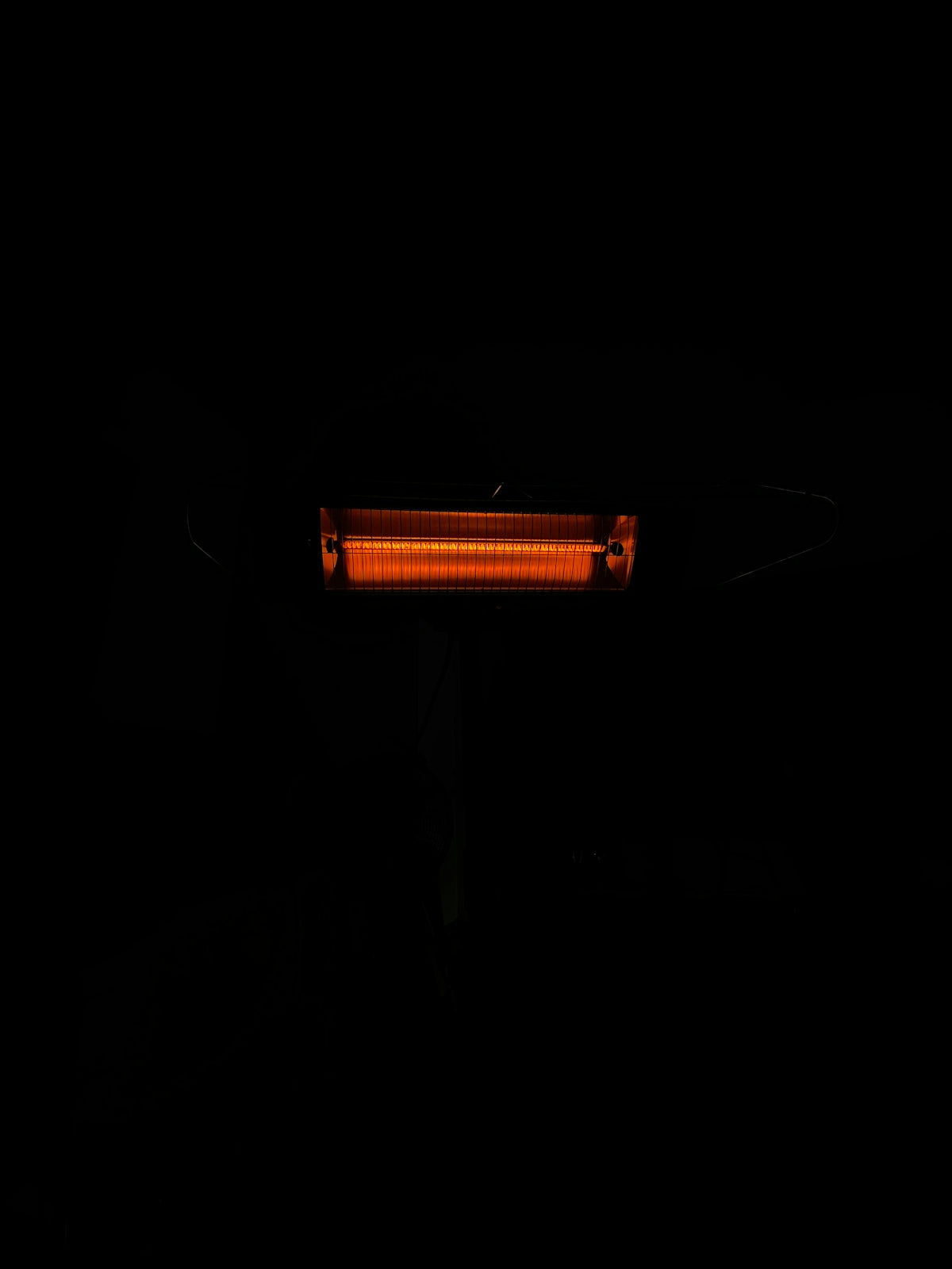 a black background with a red light in the dark