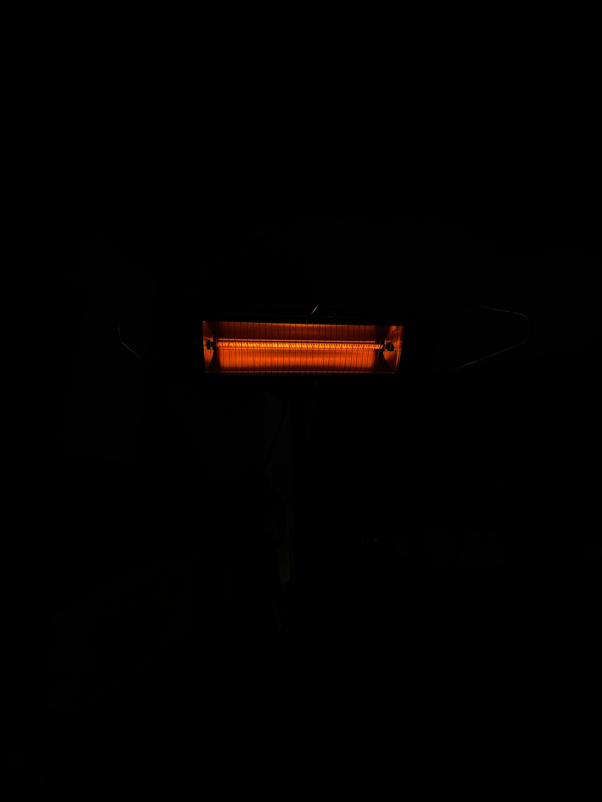 a black background with a red light in the dark