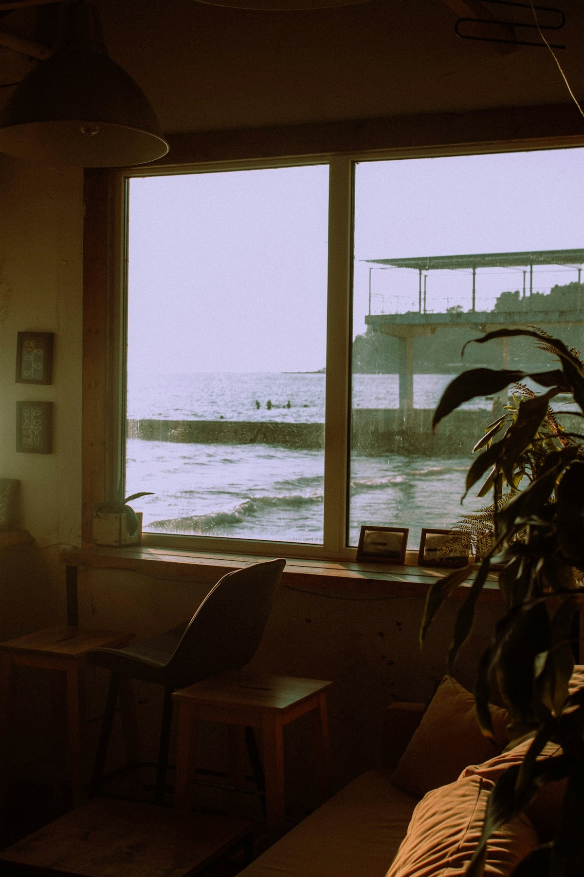 a living room filled with furniture and a large window