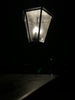 a street light lit up in the dark