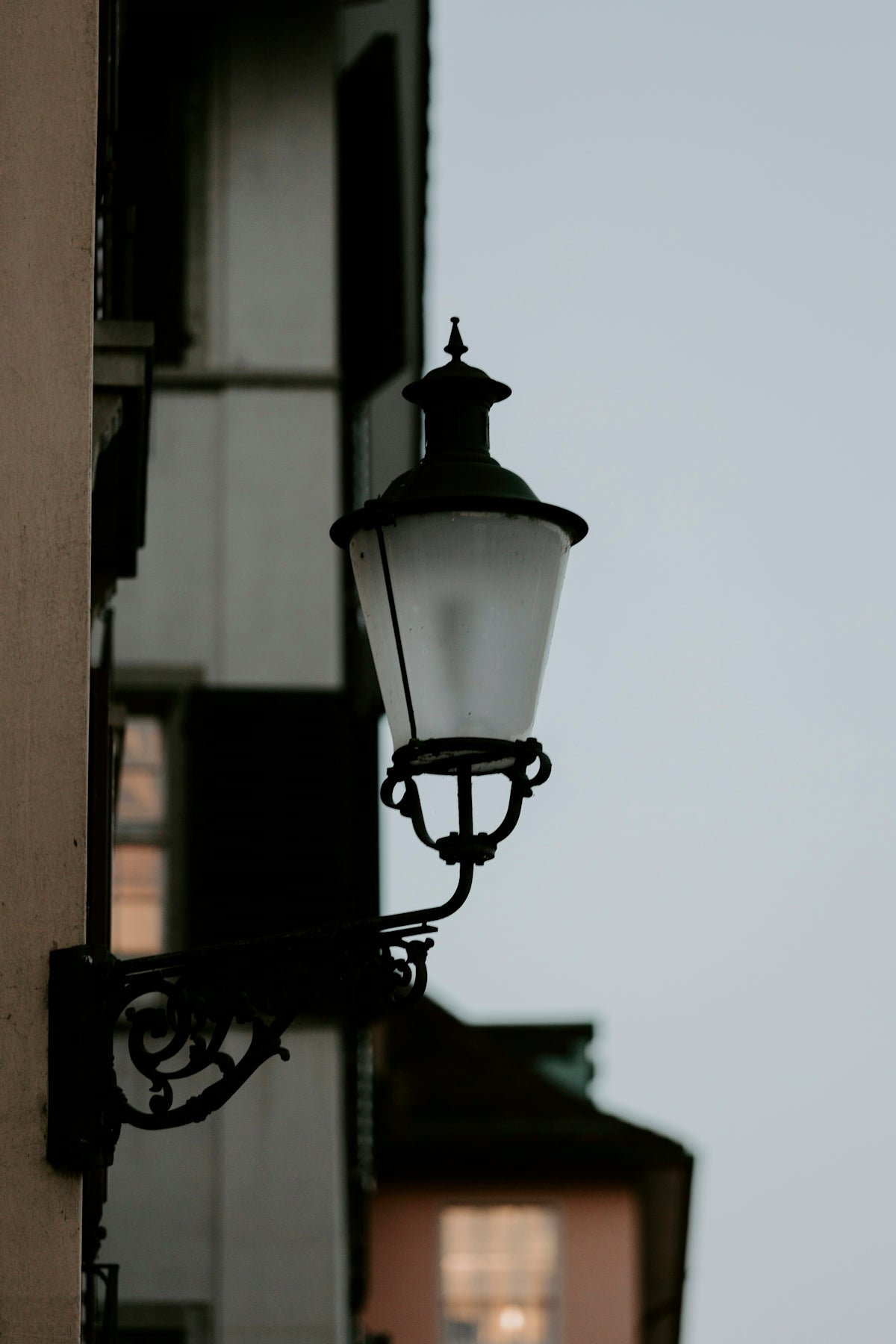 a street light hanging off the side of a building