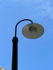 a street light with a blue sky in the background