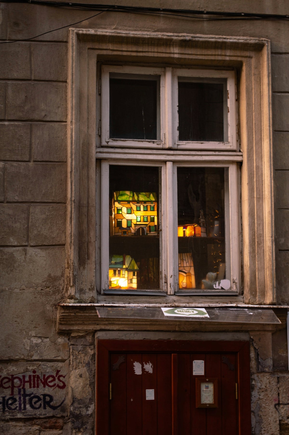 a building with a red door and a window