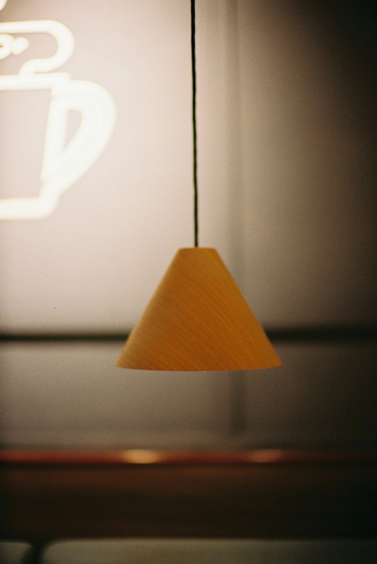 a wooden light fixture hanging from a ceiling