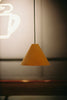 a wooden light fixture hanging from a ceiling