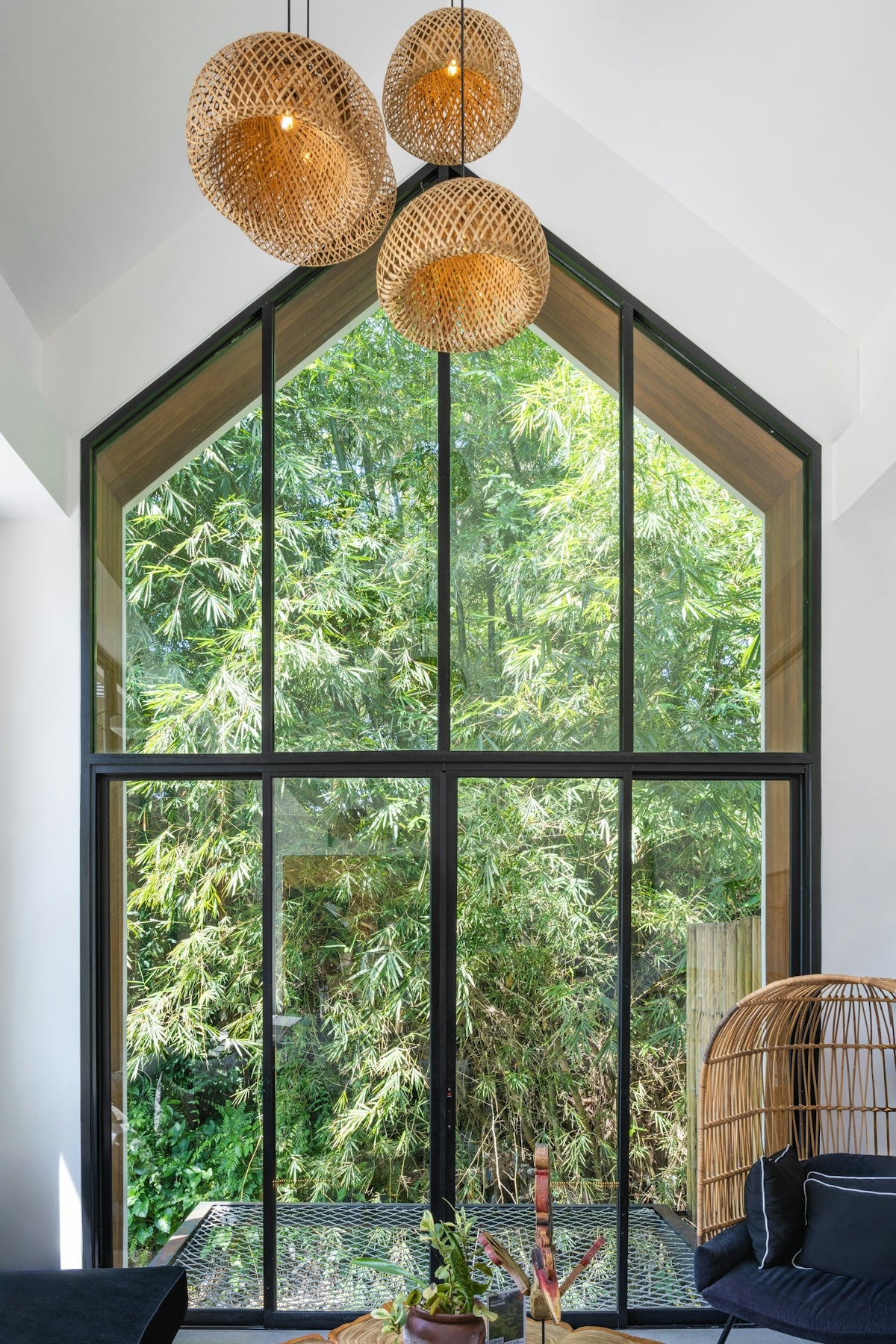 A living room filled with furniture and a large window