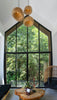A living room with a large window and a wooden table