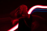 A blurry photo of a woman with a cell phone
