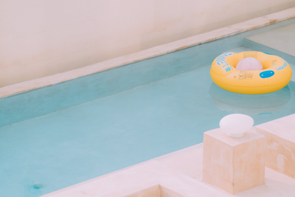 A toy boat floating on top of a pool