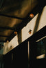 A group of lights hanging from the side of a building
