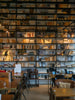 A room filled with lots of books on shelves