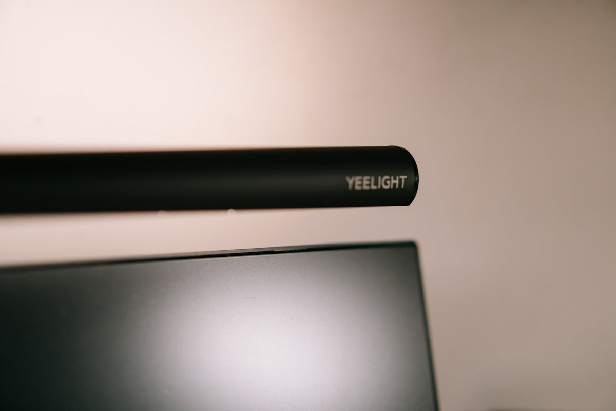 A yeelight monitor light is shown above a screen.