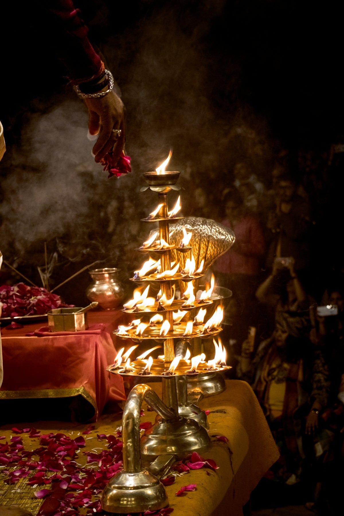 A tiered oil lamp with many flames