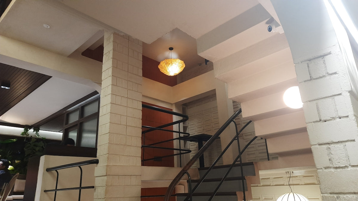 Interior view of a modern staircase with lighting.