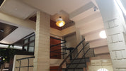 Interior view of a modern staircase with lighting.