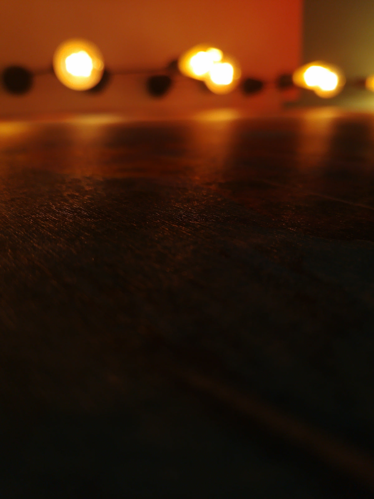 String of warm lights blurred in background