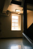 Stairwell with window and pipes